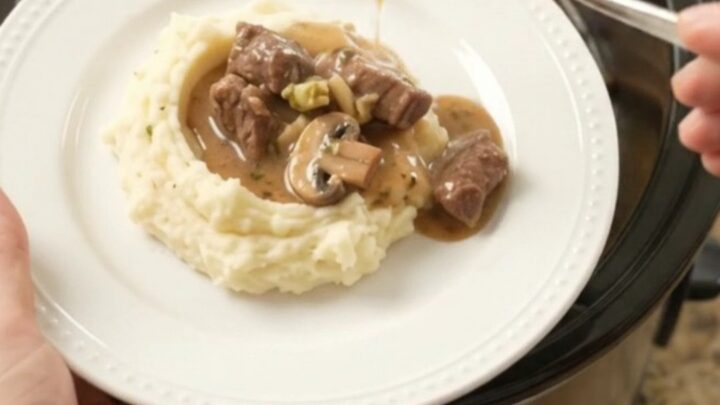 Slow cooker beef tenderloin tips with broccoli and mushrooms in a rich au jus sauce.