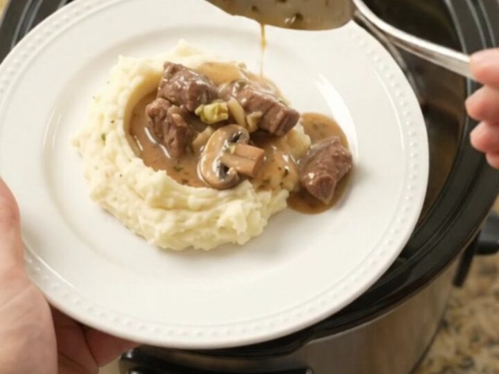 Slow cooker beef tenderloin tips with broccoli and mushrooms in a rich au jus sauce.
