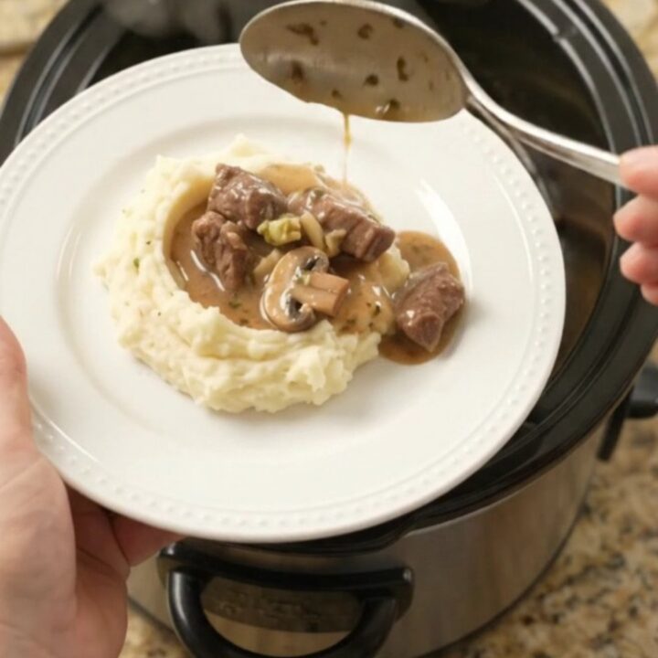 Slow cooker beef tenderloin tips with broccoli and mushrooms in a rich au jus sauce.