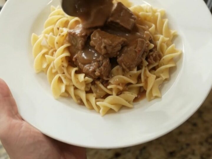 Slow cooker beef tenderloin tips with carrots and potatoes in a rich gravy