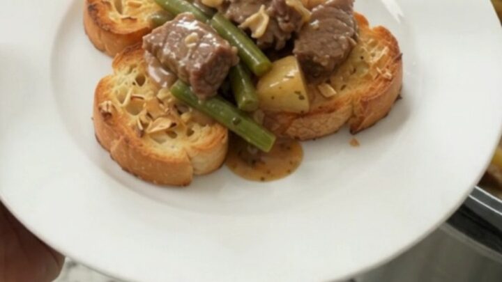Slow cooker with creamy Gruyère beef tips, green beans, and potatoes