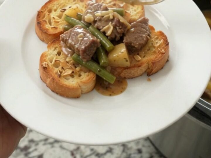 Slow cooker with creamy Gruyère beef tips, green beans, and potatoes