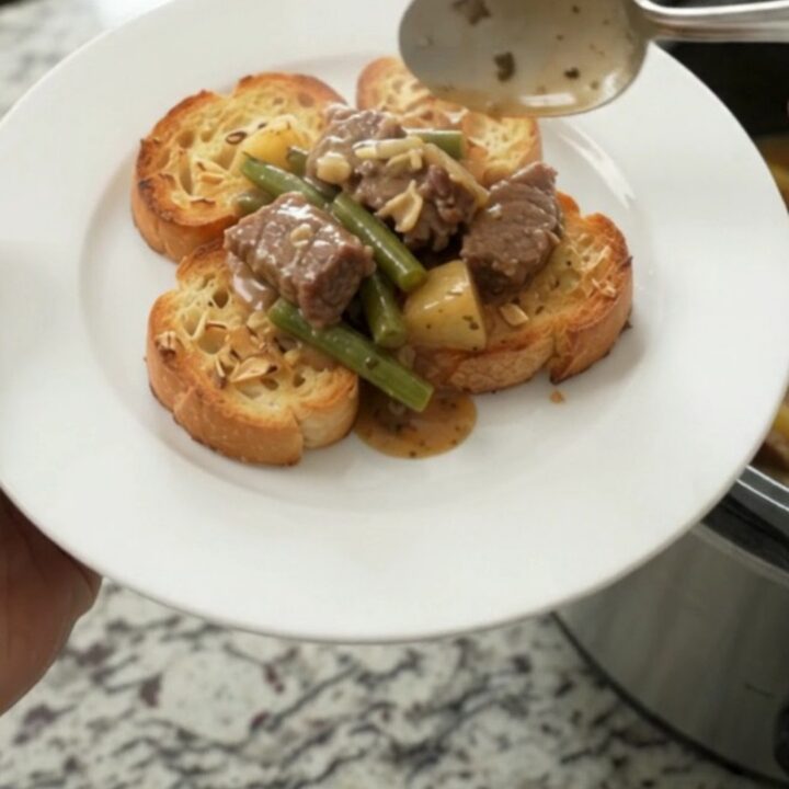 Slow cooker with creamy Gruyère beef tips, green beans, and potatoes