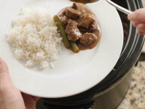 Slow cooker beef tenderloin tips with green beans and potatoes in bourbon gravy