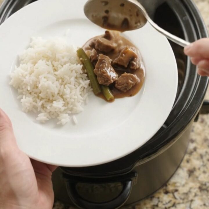Slow cooker beef tenderloin tips with green beans and potatoes in bourbon gravy