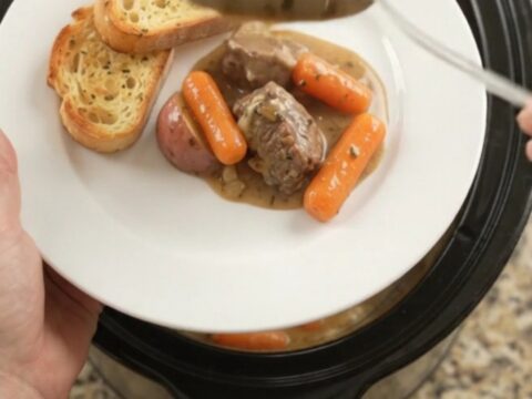 Slow cooker beef tenderloin tips with carrots and potatoes in a creamy Gruyère sauce