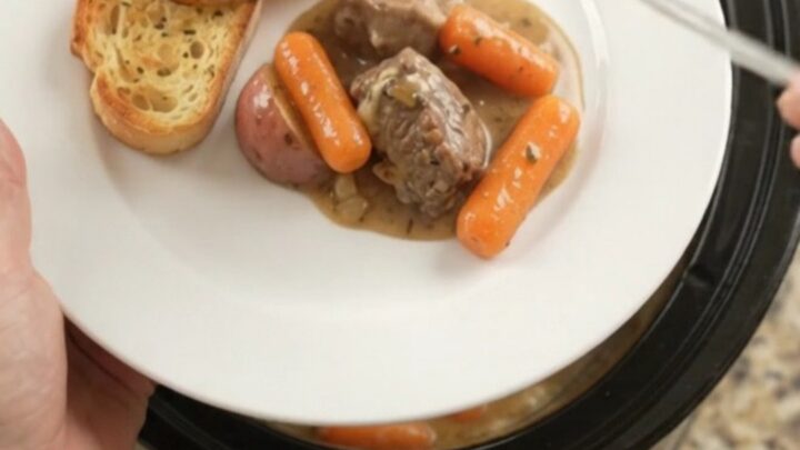 Slow cooker beef tenderloin tips with carrots and potatoes in a creamy Gruyère sauce