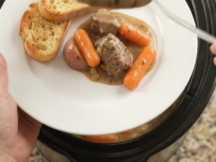 Slow cooker beef tenderloin tips with carrots and potatoes in a creamy Gruyère sauce