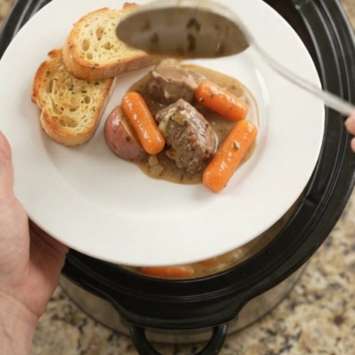 Slow cooker beef tenderloin tips with carrots and potatoes in a creamy Gruyère sauce
