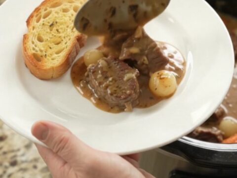 Slow-cooked beef tenderloin tips in creamy Gruyère sauce with pearl onions and carrots, served in a Crockpot