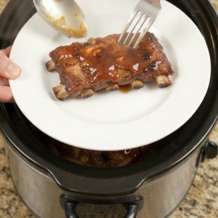Slow-cooker baby back ribs glazed with honey hickory BBQ sauce and caramelized onions