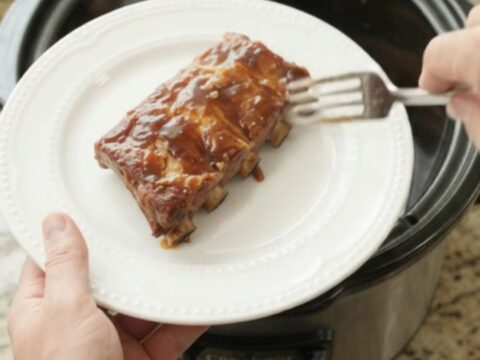 Slow cooker pineapple molasses spare ribs with caramelized pineapple rings and glossy sauce