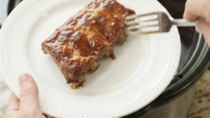 Slow cooker pineapple molasses spare ribs with caramelized pineapple rings and glossy sauce