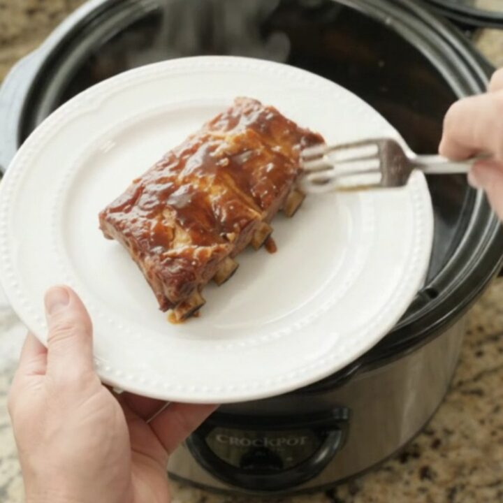 Slow cooker pineapple molasses spare ribs with caramelized pineapple rings and glossy sauce