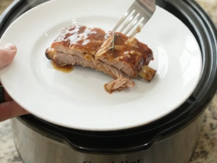 Tender slow-cooker spare ribs glazed with honey-hickory BBQ sauce