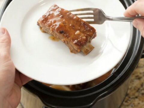 Tender country-style pork ribs glazed in maple-bourbon barbecue sauce in a slow cooker