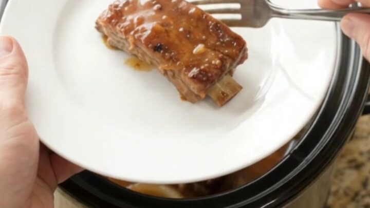 Tender country-style pork ribs glazed in maple-bourbon barbecue sauce in a slow cooker