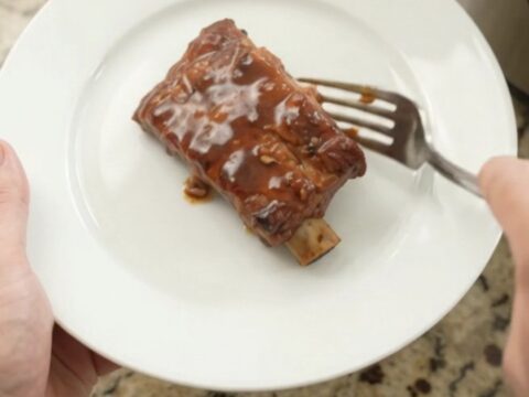 Slow-cooker country ribs with pineapple rings in a glossy molasses sauce