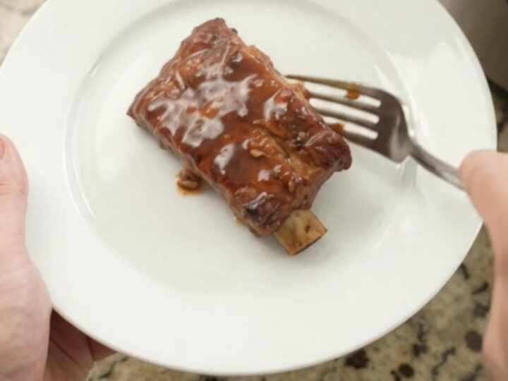 Slow-cooker country ribs with pineapple rings in a glossy molasses sauce