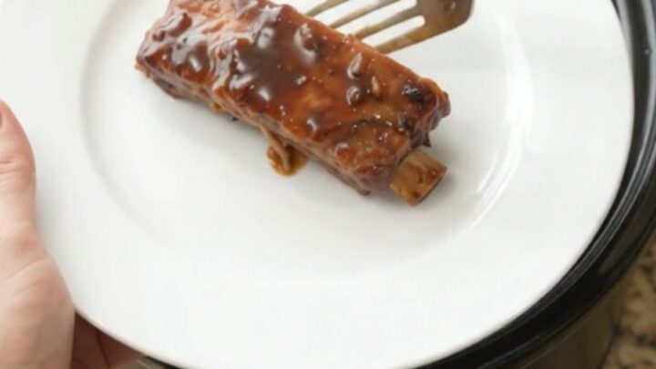 Glazed country-style pork ribs in a slow cooker with garlic and rosemary