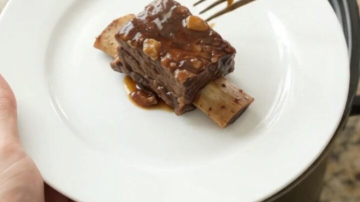 Slow-cooker beef short ribs in a glossy molasses garlic sauce with rosemary