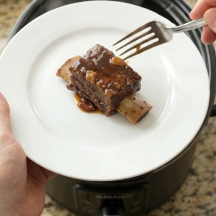 Slow-cooker beef short ribs in a glossy molasses garlic sauce with rosemary
