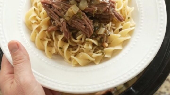 Shredded chuck roast in slow cooker with mushrooms and gravy