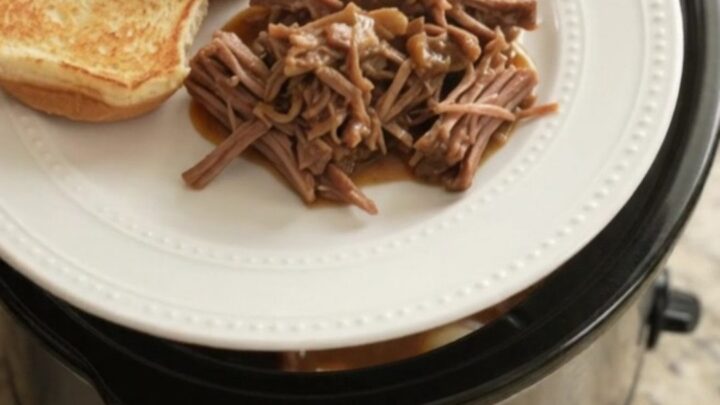 Shredded beef chuck roast with pearl onions in rich Guinness gravy, served on a toasted brioche slider bun