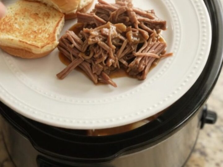 Shredded beef chuck roast with pearl onions in rich Guinness gravy, served on a toasted brioche slider bun