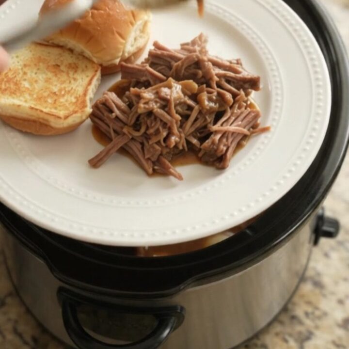 Shredded beef chuck roast with pearl onions in rich Guinness gravy, served on a toasted brioche slider bun