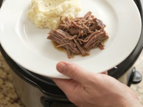 Slow-cooker beef chuck roast with shallots and carrots in a golden butter sauce