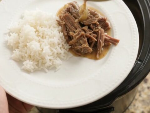 Slow-cooker Dijon cream chuck roast with herbs, shredded and served over rice