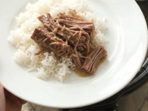 Shredded beef chuck roast with creamy Dijon gravy in a slow cooker