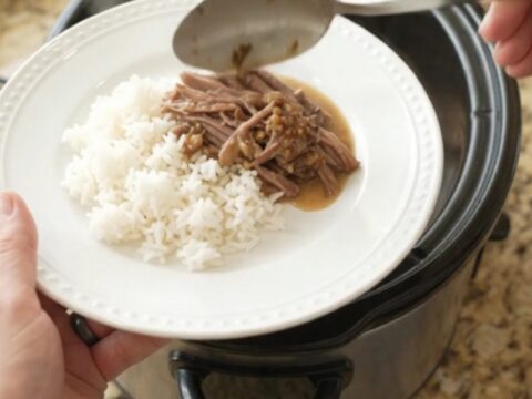Shredded beef chuck roast in creamy Dijon sauce with portobello mushrooms in a slow cooker