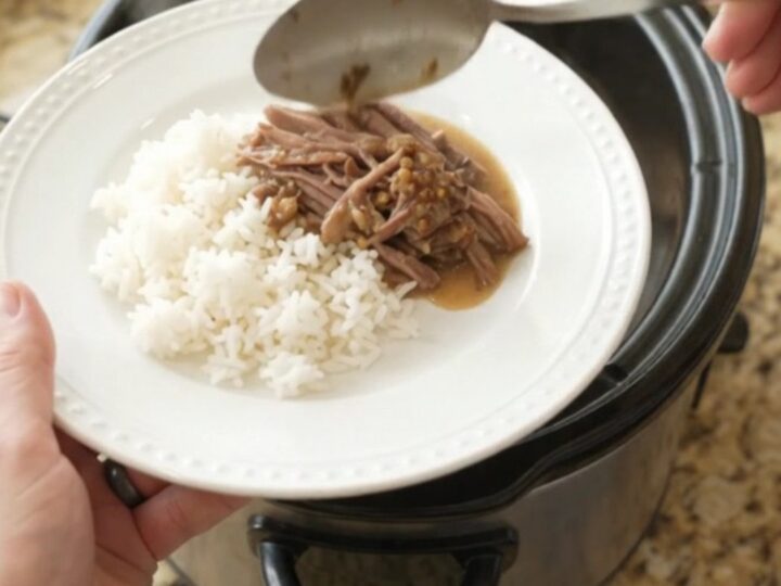Shredded beef chuck roast in creamy Dijon sauce with portobello mushrooms in a slow cooker