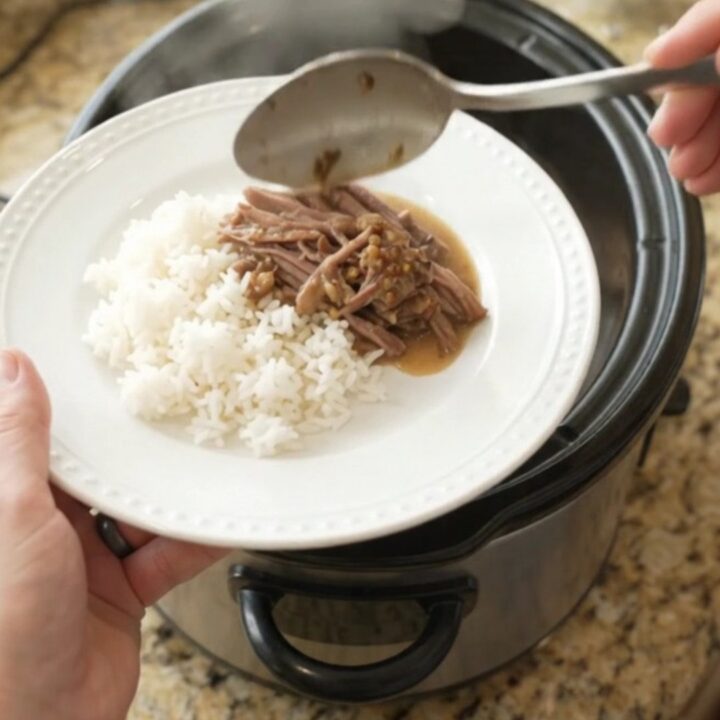 Shredded beef chuck roast in creamy Dijon sauce with portobello mushrooms in a slow cooker
