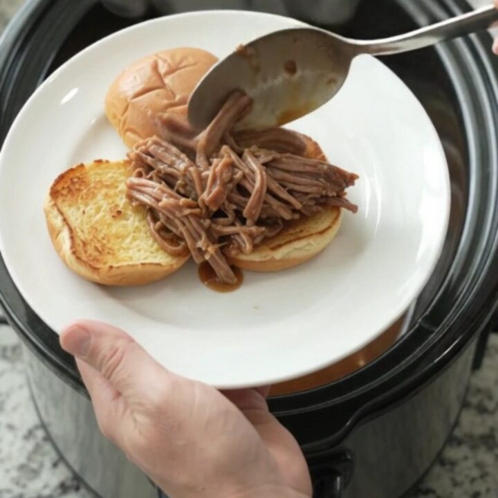 Slow-cooker beef brisket with pepperoncini and gravy, served on toasted brioche slider buns.