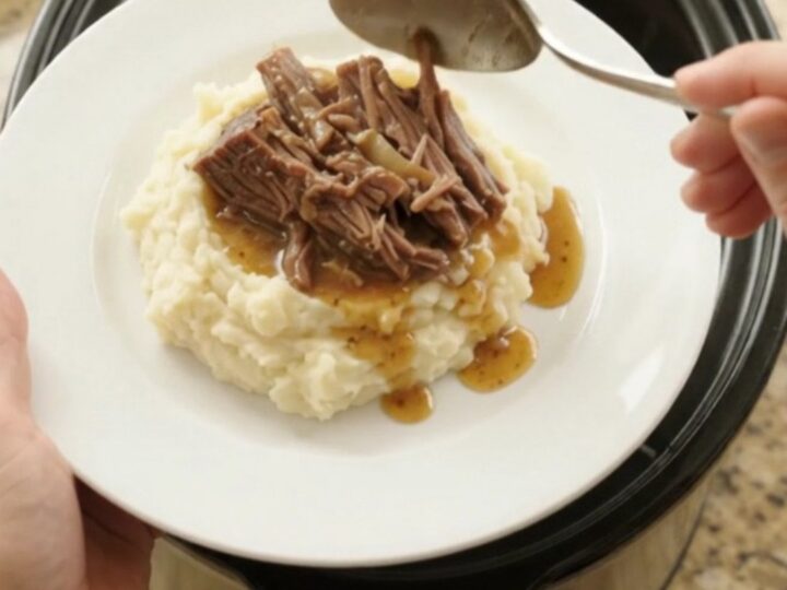 Shredded beef brisket with mushrooms and butter jus in a slow cooker