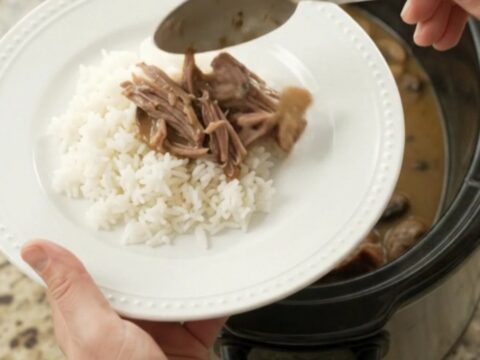 Shredded beef brisket in creamy mushroom Dijon sauce in a slow cooker