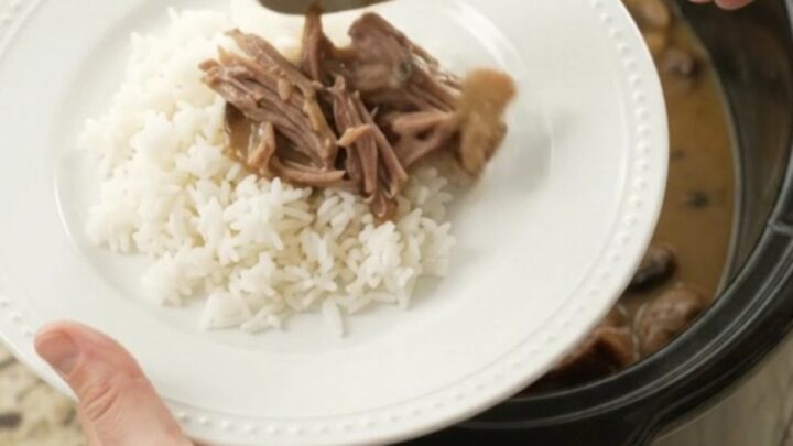 Shredded beef brisket in creamy mushroom Dijon sauce in a slow cooker