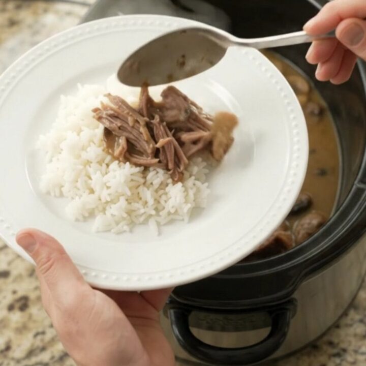 Shredded beef brisket in creamy mushroom Dijon sauce in a slow cooker