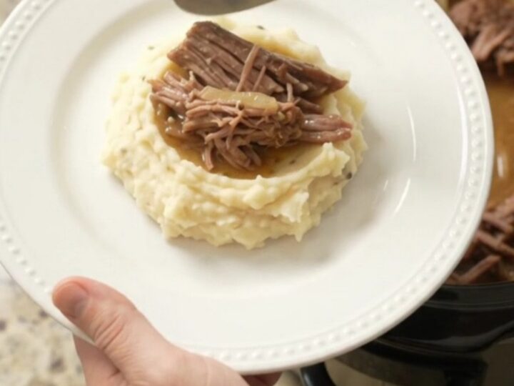 Slow cooker French onion butter beef brisket with caramelized onions and golden jus