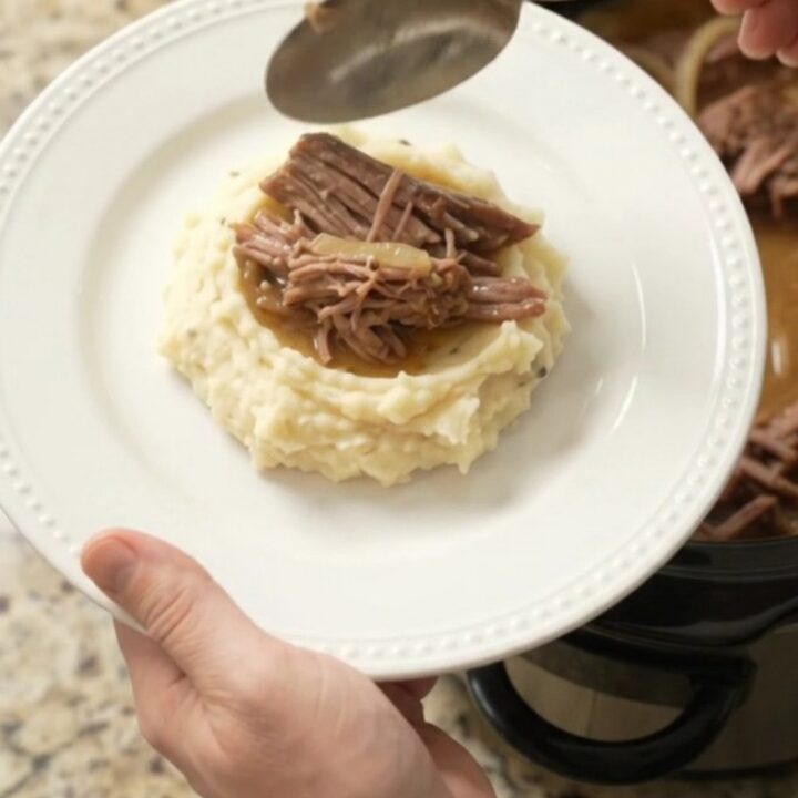 Slow cooker French onion butter beef brisket with caramelized onions and golden jus