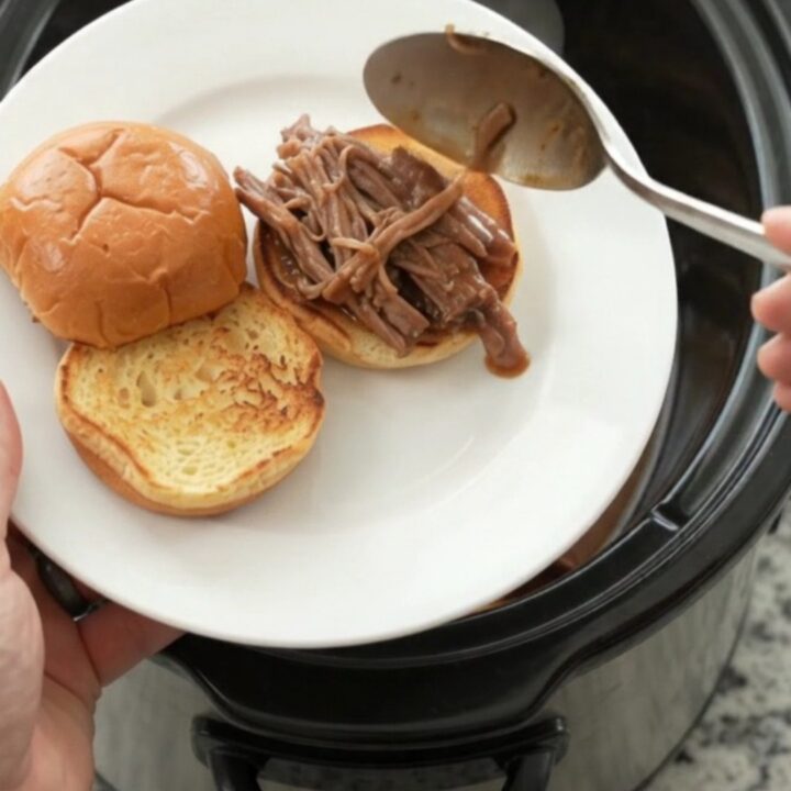 Shredded beef brisket with gravy on a toasted brioche slider bun