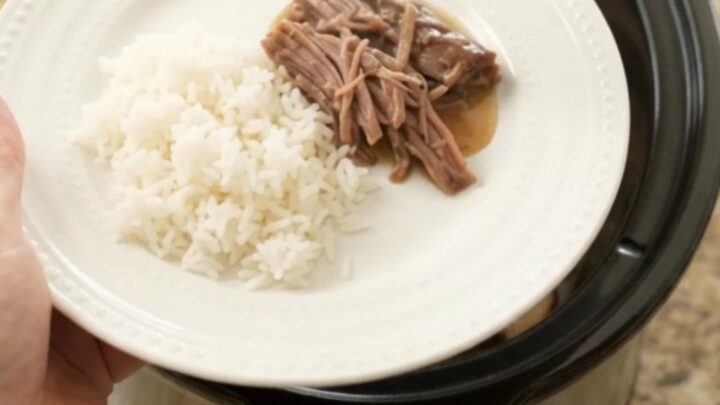 Fork-tender shredded beef brisket in creamy Dijon sauce with portobello mushrooms, served in a slow cooker