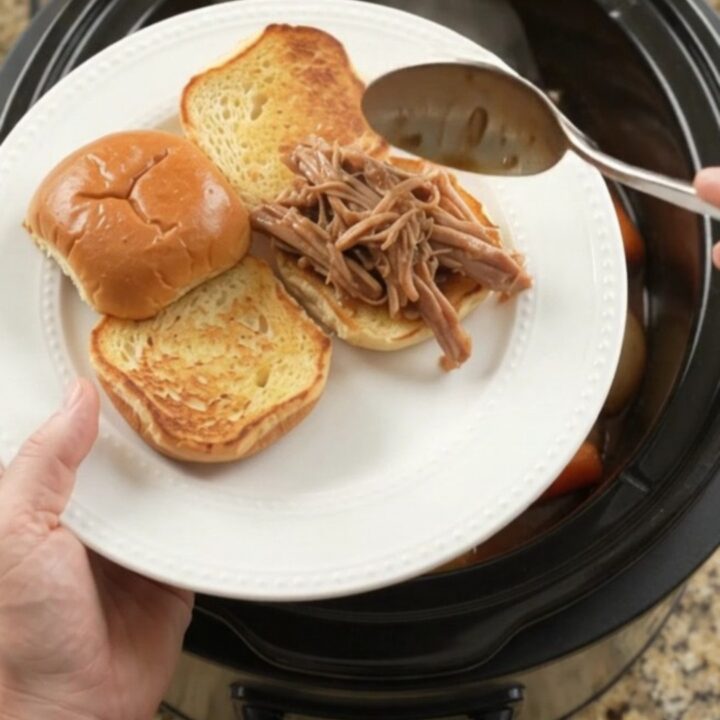 Slow-cooker pork shoulder with shallots and carrots in rich brown gravy, ready to serve