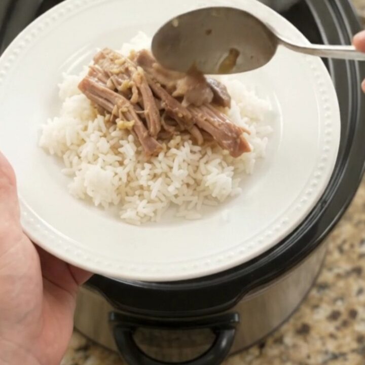 Slow-cooker pork shoulder with creamy Dijon sauce and portobello mushrooms in a black crockpot