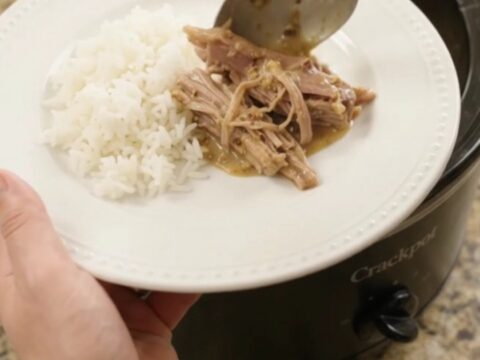 Shredded pork sirloin roast in creamy pepperoncini ranch Dijon sauce in a slow cooker