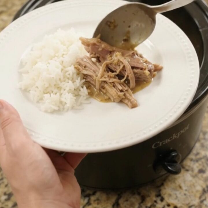Shredded pork sirloin roast in creamy pepperoncini ranch Dijon sauce in a slow cooker