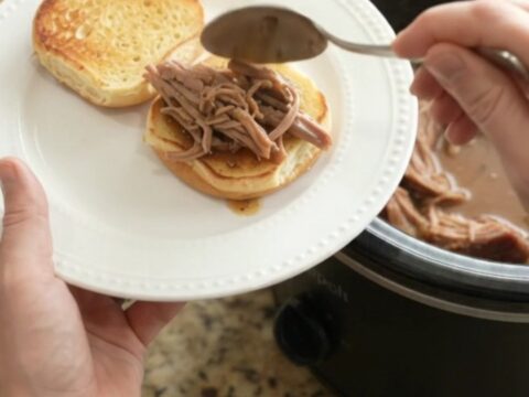 Slow-cooker pork sirloin roast with mushrooms in a glossy brown gravy